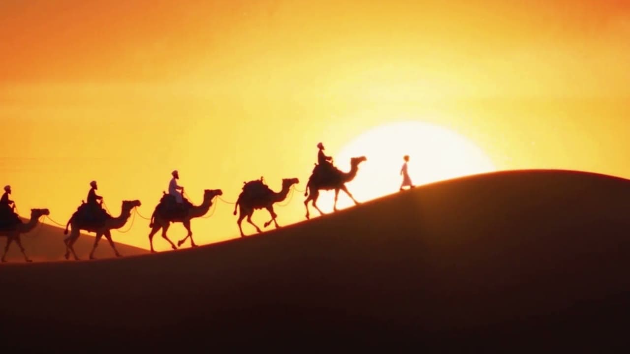 06. Wide. Sunset. The caravan crosses the dune in silhouette.